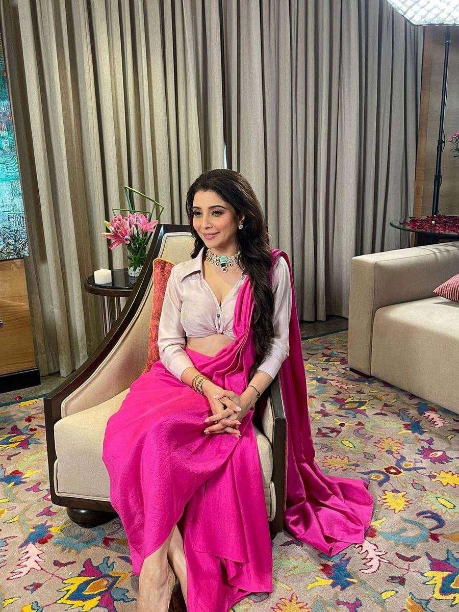 Dr. Jai Madaan, styled by Tanya Jain in a fuchsia drape