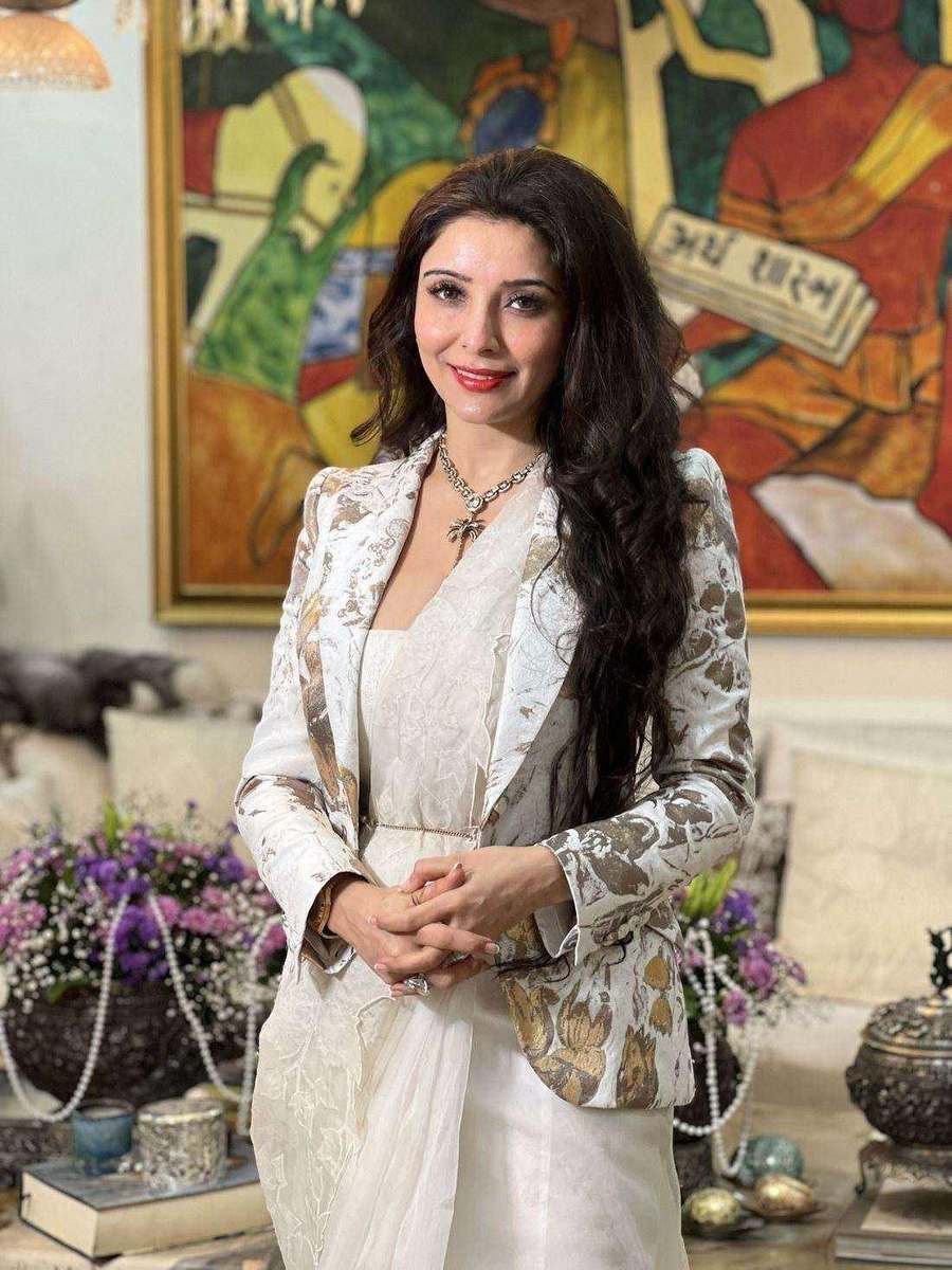An ivory outfit with a printed jacket